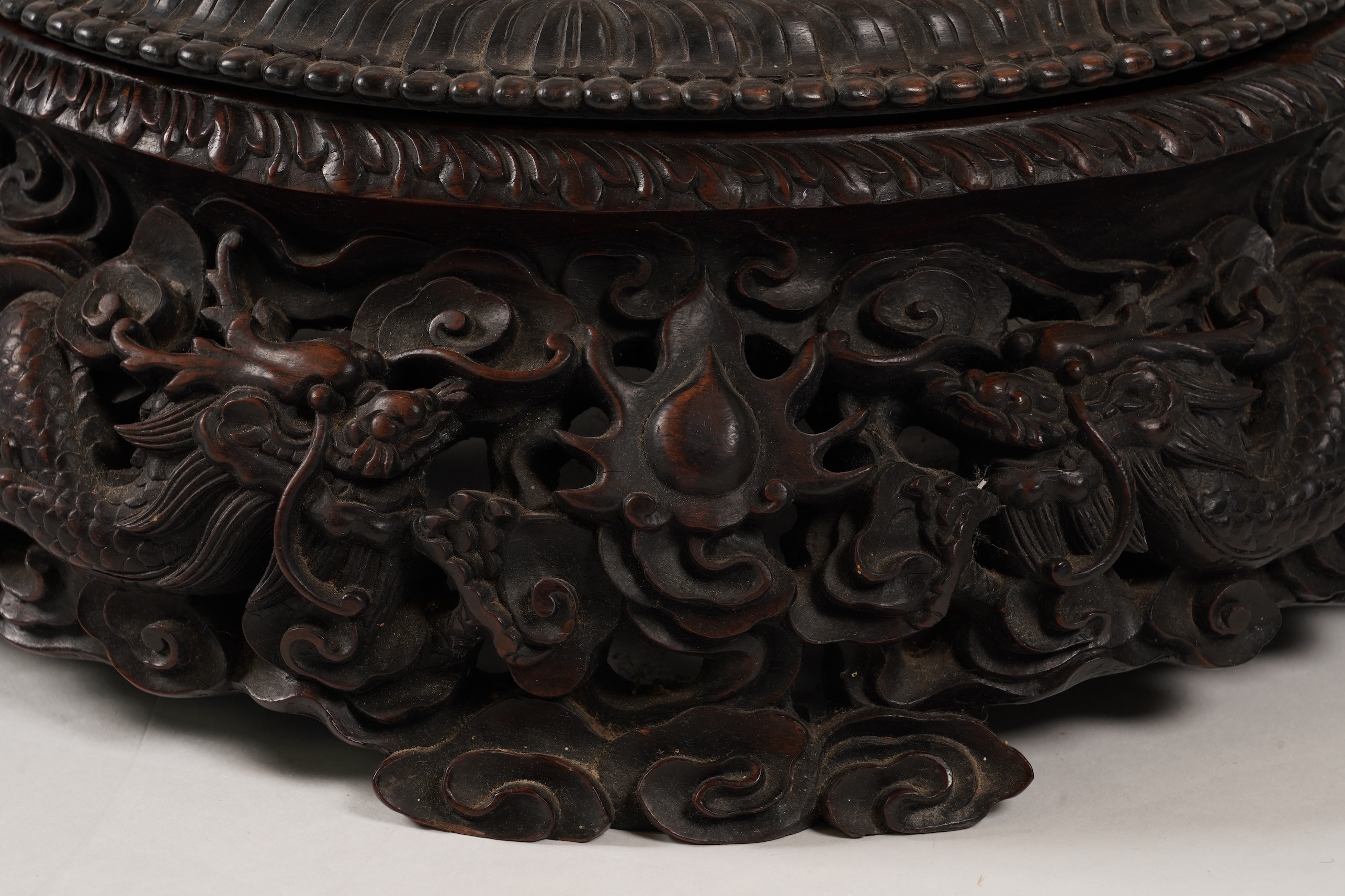 An impressive Chinese hongmu ‘dragon’ stand, late 19th century